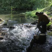 water sampling at a river bank